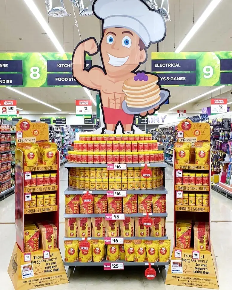 A Macro Mike display stand full of product in a store aisle